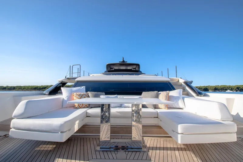 Le Gypsy Yacht Photos Pics Luxurious 2018 Sanlorenzo 102A yacht with elegant outdoor seating and scenic ocean view.