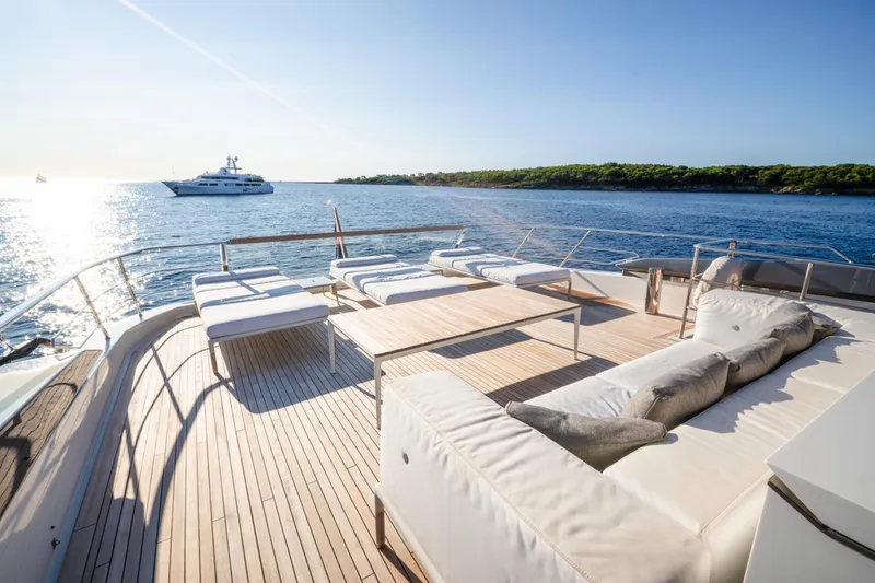 Le Gypsy Yacht Photos Pics Luxurious 2018 Sanlorenzo 102A yacht deck with sun loungers, ocean view, and serene ambiance.