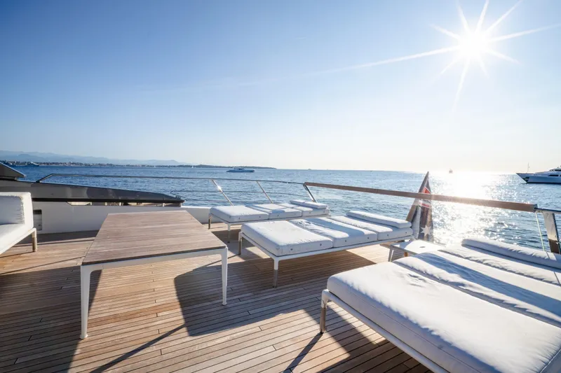 Le Gypsy Yacht Photos Pics Luxurious Sanlorenzo 102A yacht deck with sun loungers, overlooking serene ocean, 2018 model.