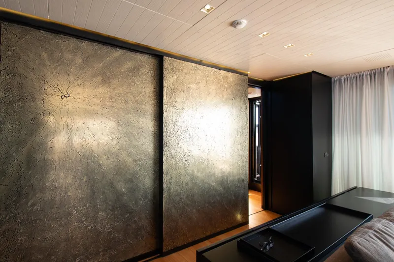 Le Gypsy Yacht Photos Pics Luxurious interior of 2018 Sanlorenzo 102A yacht with textured metallic wall panels.