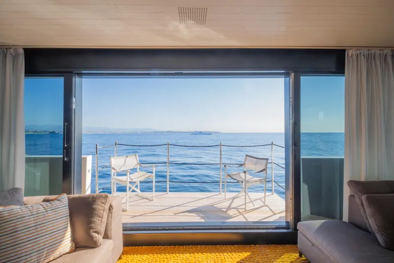 Le Gypsy Yacht Photos Pics Luxurious Sanlorenzo 102A yacht interior with ocean view, featuring elegant seating, 2018 model.