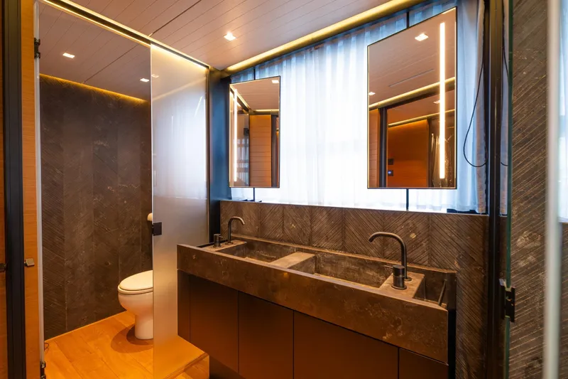 Le Gypsy Yacht Photos Pics Luxurious bathroom in 2018 Sanlorenzo 102A yacht with modern fixtures and elegant design.