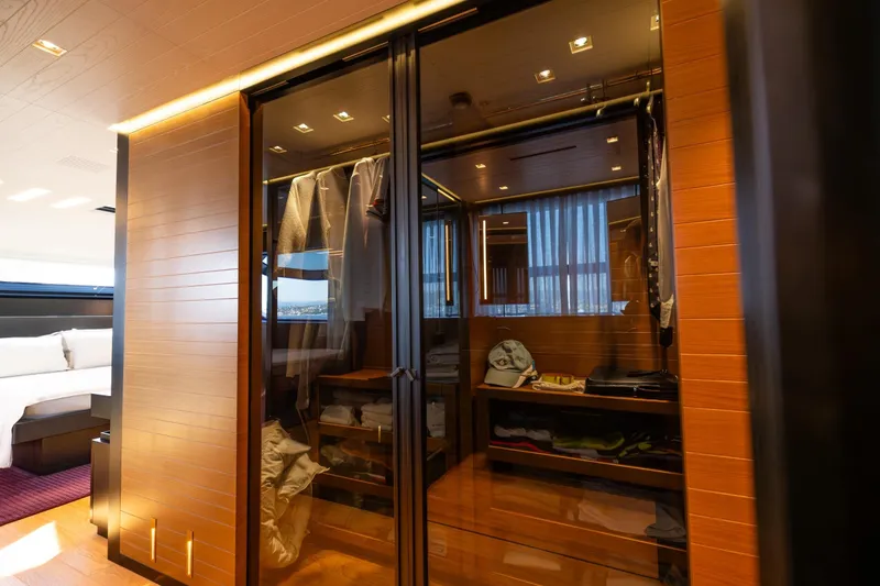Le Gypsy Yacht Photos Pics Luxurious Sanlorenzo 102A yacht interior, featuring a modern wooden wardrobe, 2018 model.