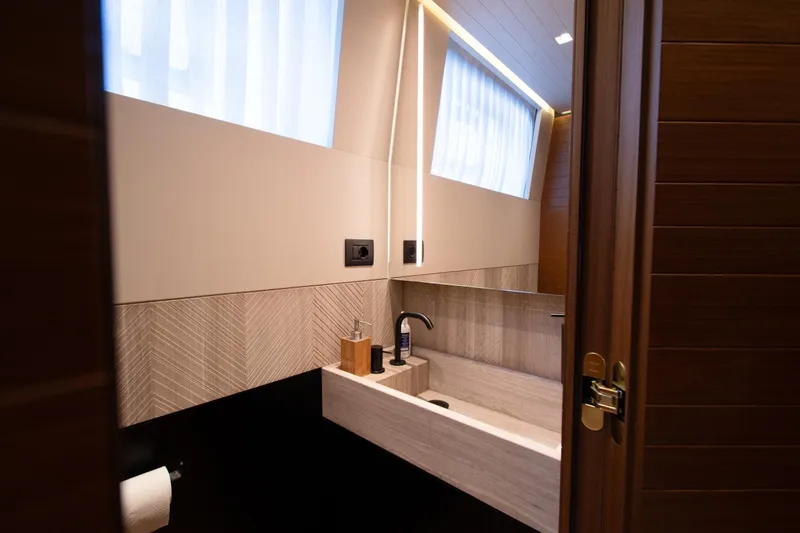 Le Gypsy Yacht Photos Pics Luxurious bathroom interior on 2018 Sanlorenzo 102A yacht, featuring modern sink and elegant design.