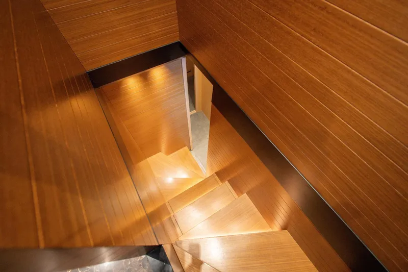 Le Gypsy Yacht Photos Pics Wooden staircase interior on 2018 Sanlorenzo 102A yacht, featuring sleek, modern design.