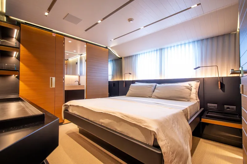 Le Gypsy Yacht Photos Pics Luxurious bedroom interior on 2018 Sanlorenzo 102A yacht, featuring modern design and ambient lighting.