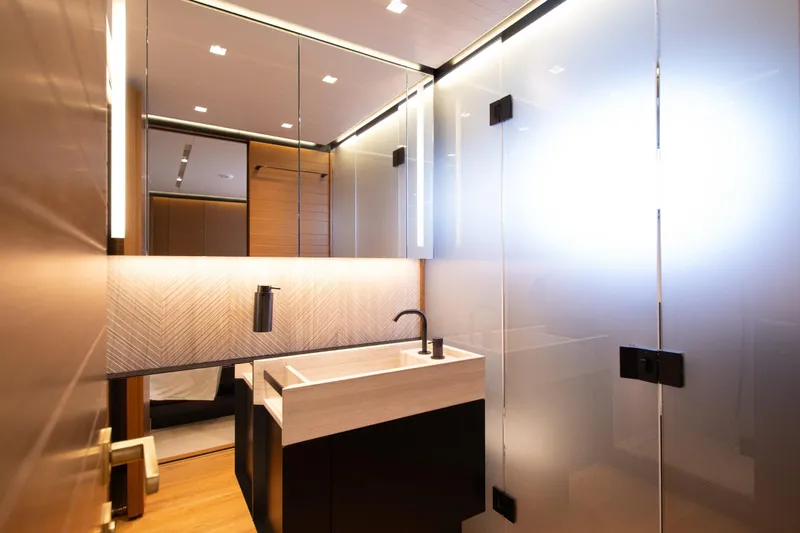 Le Gypsy Yacht Photos Pics Luxurious bathroom interior on 2018 Sanlorenzo 102A yacht, featuring modern sink and elegant lighting.
