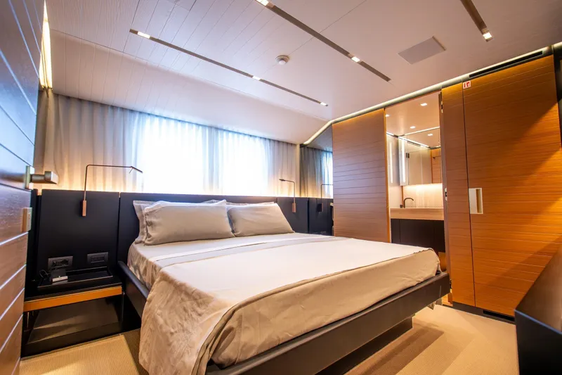 Le Gypsy Yacht Photos Pics Luxurious bedroom interior on 2018 Sanlorenzo 102A yacht, featuring modern design and elegant furnishings.