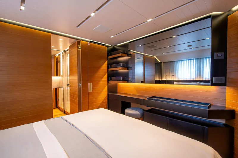 Le Gypsy Yacht Photos Pics Luxurious interior of 2018 Sanlorenzo 102A yacht with modern wood paneling and ambient lighting.