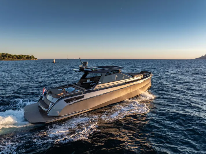 Virtus Yacht Photos Pics Steeler B50 AQUAZEN 2022 yacht cruising on open water at sunset.