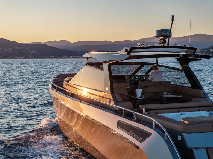 Virtus Yacht Photos Pics 2022 Steeler B50 AQUAZEN yacht cruising at sunset on serene waters.
