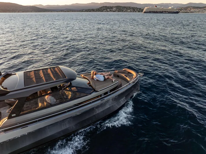 Virtus Yacht Photos Pics 2022 Steeler B50 AQUAZEN yacht cruising on serene waters at sunset.