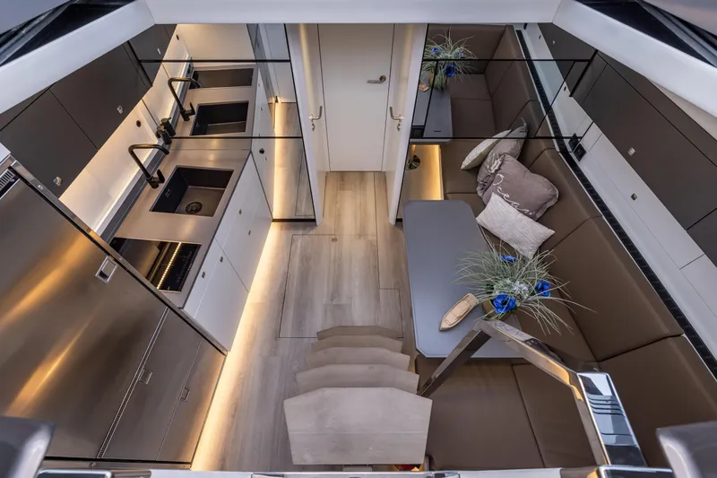 Virtus Yacht Photos Pics Luxurious interior of 2022 Steeler B50 AQUAZEN yacht with modern kitchen and seating area.