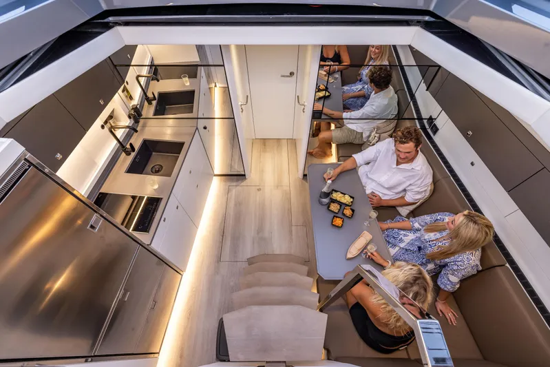 Virtus Yacht Photos Pics Luxurious interior of 2022 Steeler B50 AQUAZEN yacht with modern kitchen and dining area.