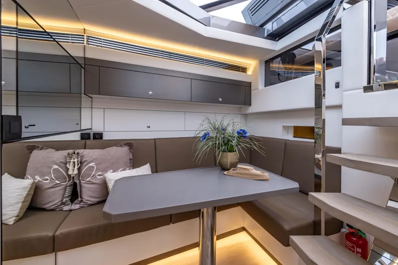 Virtus Yacht Photos Pics Luxurious interior of 2022 Steeler B50 AQUAZEN yacht with modern seating and elegant decor.