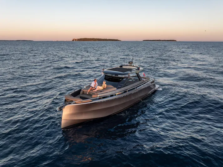 Virtus Yacht Photos Pics 2022 Steeler B50 AQUAZEN yacht cruising on open sea at sunset.