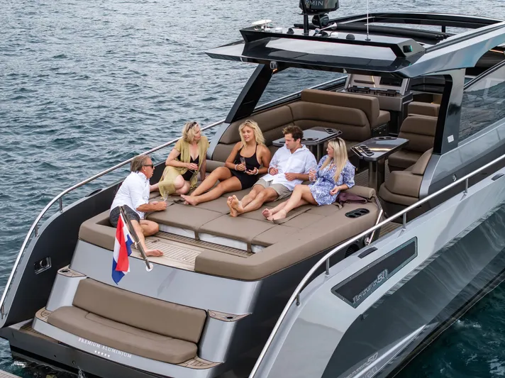 Virtus Yacht Photos Pics 2022 Steeler B50 AQUAZEN yacht with people relaxing on deck, enjoying the water.
