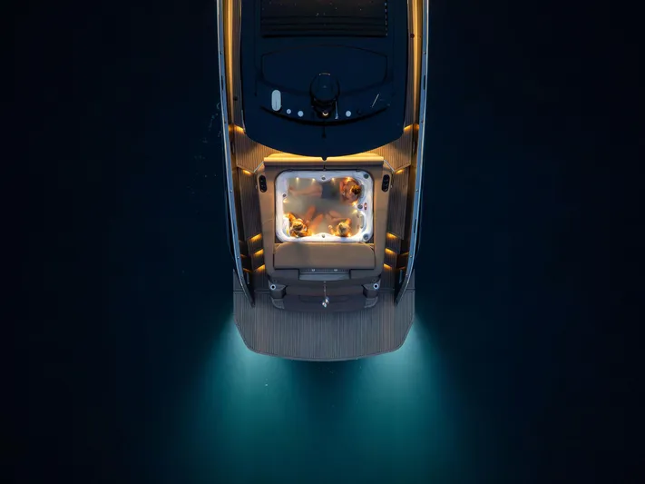 Virtus Yacht Photos Pics Aerial view of 2022 Steeler B50 AQUAZEN yacht with illuminated deck and hot tub at night.