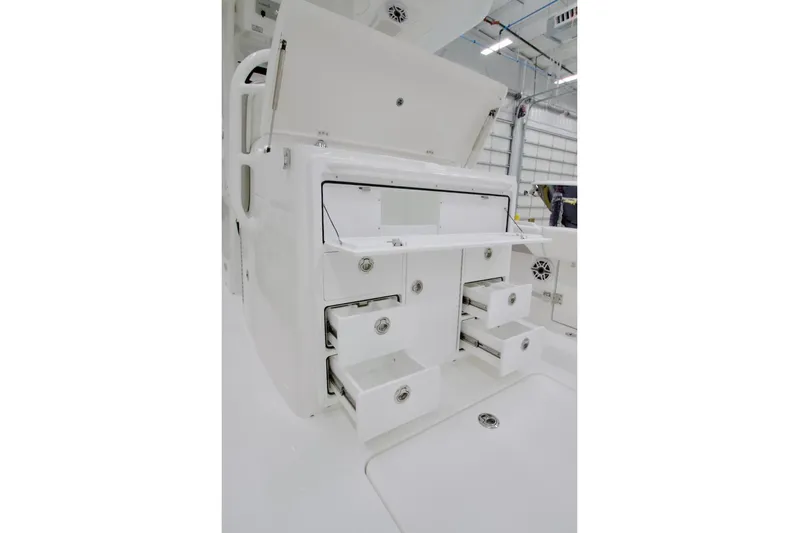 31-406 Yacht Photos Pics 2026 Regulator 31 boat storage compartments with open drawers in a bright interior.