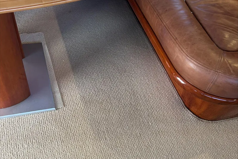 Lucky Yacht Photos Pics Interior of 1983 Rybovich 55 Convertible, featuring leather seating and wooden table.