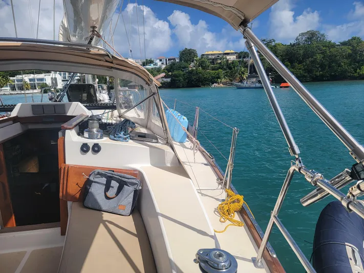 Rio Yacht Photos Pics Sailing yacht Tartan 4300, 2008 model, docked in a serene tropical bay.