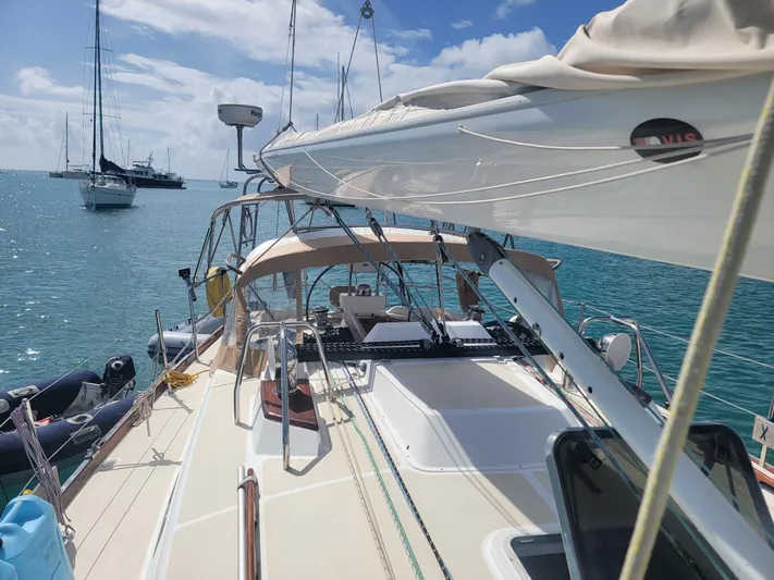 Rio Yacht Photos Pics Tartan 4300 sailboat from 2008 on calm blue waters under a clear sky.