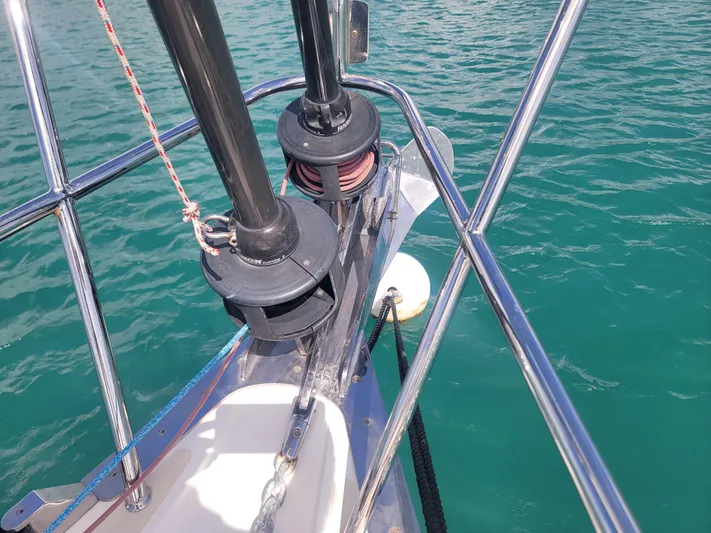 Rio Yacht Photos Pics Bow of 2008 Tartan 4300 sailboat with stainless steel fittings on turquoise water.