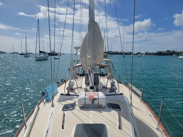 Rio Yacht Photos Pics Sailboat Tartan 4300, 2008 model, anchored in a sunny marina.