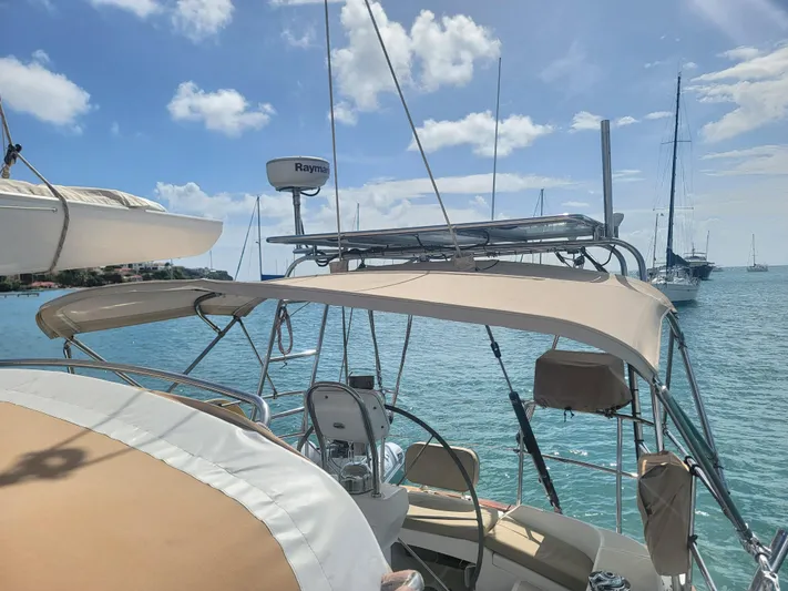 Rio Yacht Photos Pics Sailboat Tartan 4300, 2008 model, docked in sunny marina with clear blue skies.