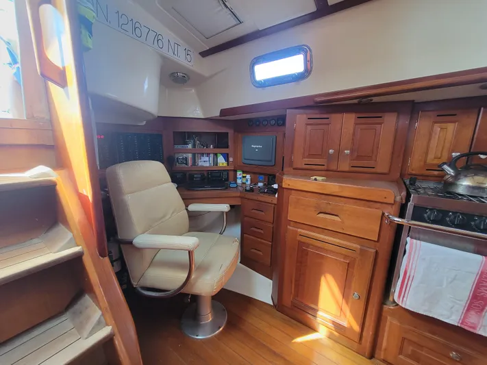 Rio Yacht Photos Pics Interior of 2008 Tartan 4300 sailboat with wooden cabinetry and navigation station.