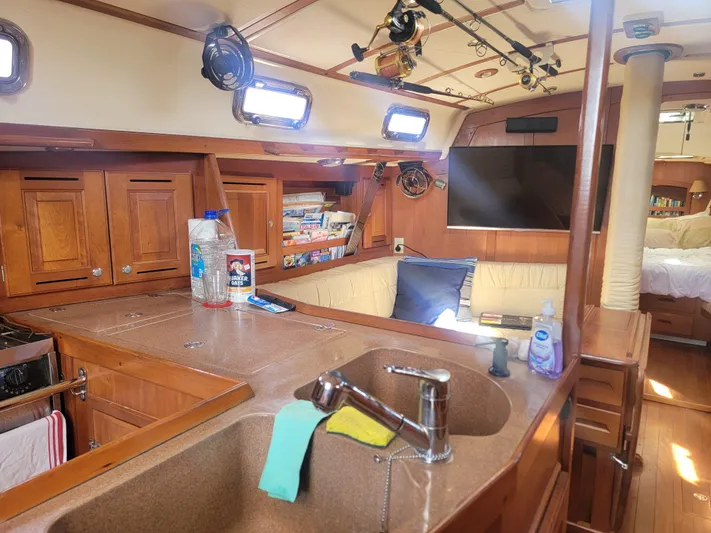 Rio Yacht Photos Pics Interior of 2008 Tartan 4300 sailboat with cozy seating and kitchen area.