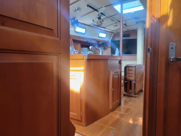 Rio Yacht Photos Pics Interior of 2008 Tartan 4300 yacht with wooden cabinetry and natural light.