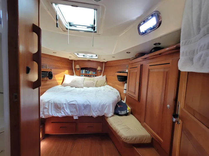 Rio Yacht Photos Pics Cozy cabin interior of 2008 Tartan 4300 yacht with wooden furnishings and skylight.
