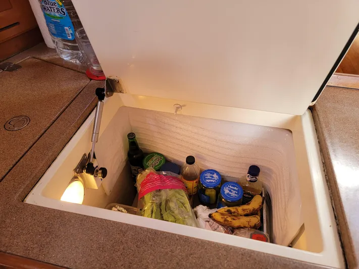 Rio Yacht Photos Pics Built-in cooler with assorted groceries in a 2008 Tartan 4300 yacht kitchen.