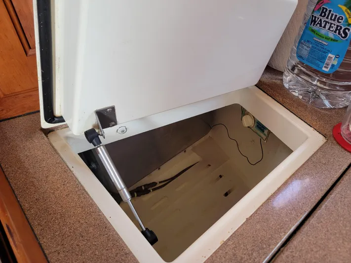 Rio Yacht Photos Pics Open hatch on 2008 Tartan 4300 yacht with water bottle nearby.