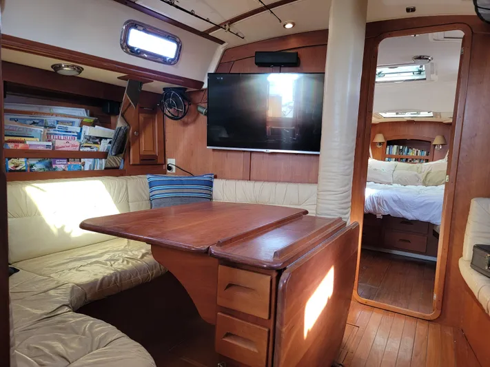 Rio Yacht Photos Pics Interior of 2008 Tartan 4300 yacht with cozy seating and wooden finishes.
