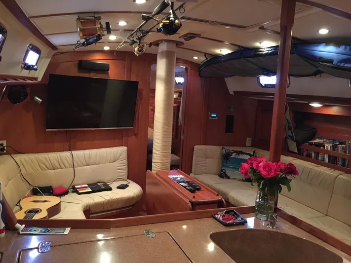 Rio Yacht Photos Pics Luxurious 2008 Tartan 4300 yacht interior with cozy seating, TV, and elegant decor.