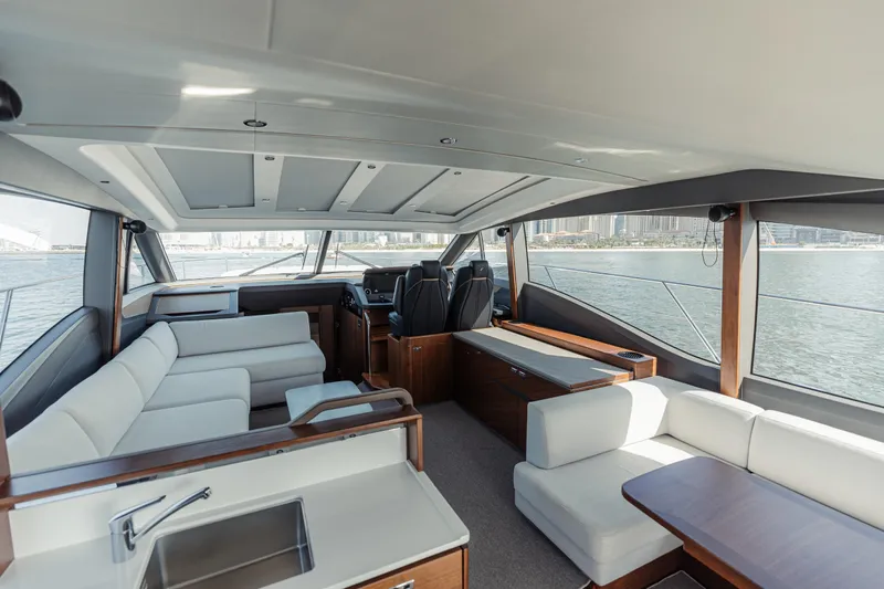  Yacht Photos Pics Luxurious interior of 2020 Princess V60 yacht with elegant seating and panoramic windows.