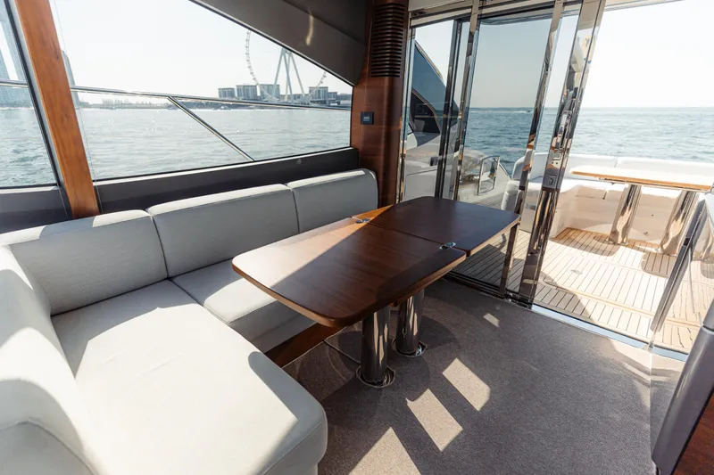  Yacht Photos Pics Luxurious interior of 2020 Princess V60 yacht with elegant seating and ocean view.