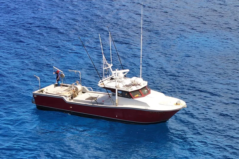  Yacht Photos Pics Custom Hoku 40 boat, 2018 model, on vibrant blue ocean waters.