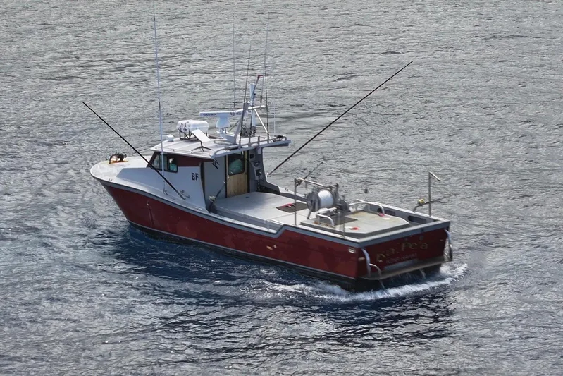  Yacht Photos Pics Red and white Custom Hoku 40 boat on water, 2018 model, with fishing equipment.