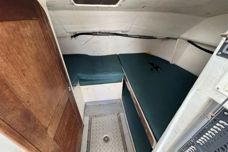  Yacht Photos Pics Small cabin interior of 2018 Custom Hoku 40 boat with green cushions.