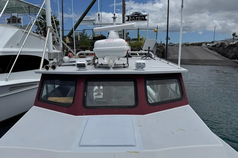  Yacht Photos Pics Custom Hoku 40 boat docked at marina, 2018 model, with overcast sky.