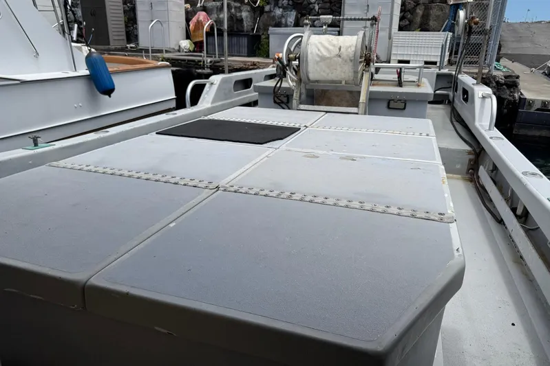  Yacht Photos Pics Custom Hoku 40 boat deck with storage compartments, docked at a marina, 2018 model.