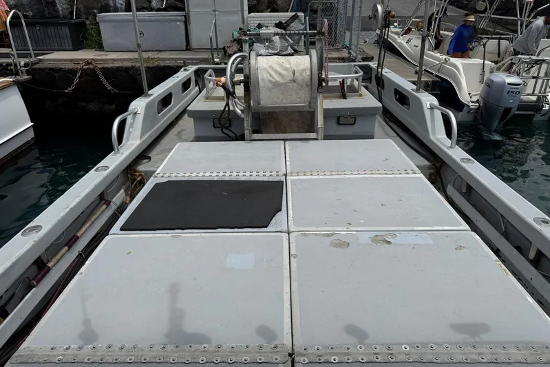  Yacht Photos Pics Open deck of a 2018 Custom Hoku 40 boat docked at a marina.