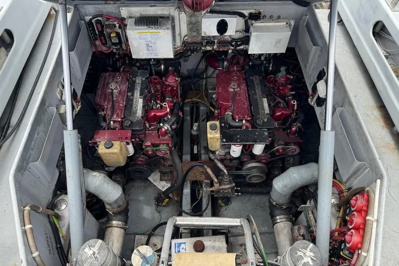  Yacht Photos Pics Engine compartment of a 2018 Custom Hoku 40 boat, featuring dual red engines.