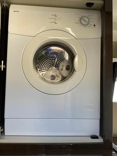  Yacht Photos Pics White front-loading washing machine in a Carver C52 Coupe, 2018 model.