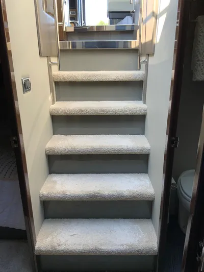 Yacht Photos Pics Staircase inside 2018 Carver C52 Coupe yacht, leading to upper deck.