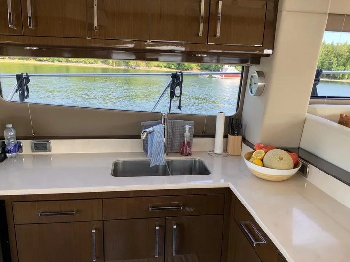  Yacht Photos Pics Luxurious kitchen interior of 2018 Carver C52 Coupe yacht with lake view.