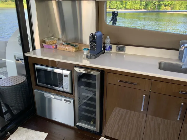  Yacht Photos Pics Modern kitchen in 2018 Carver C52 Coupe yacht with appliances and lake view.